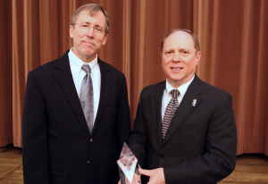 Charles Cascio (right) receives the Distinguished Fellow Award